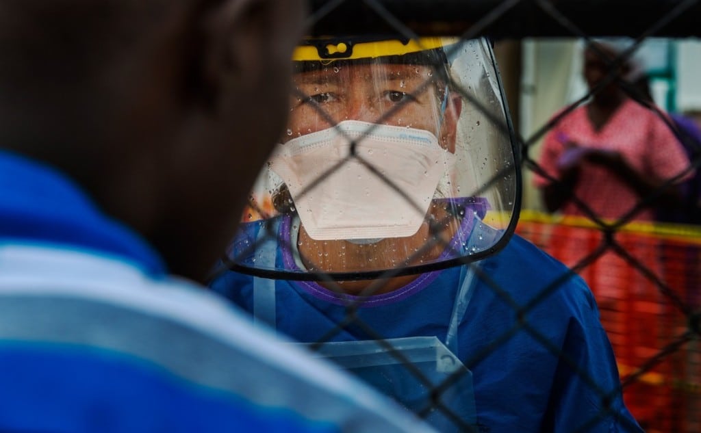 A U.N. representative in an Ebola ward. Image from the Washington Post.